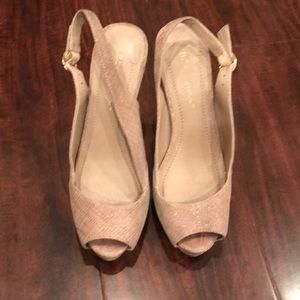 In great condition; platform slingback with an elegant of shimmer beige texture